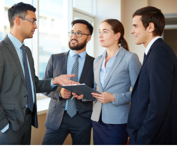 Corporate team members discussing manpower requirements.