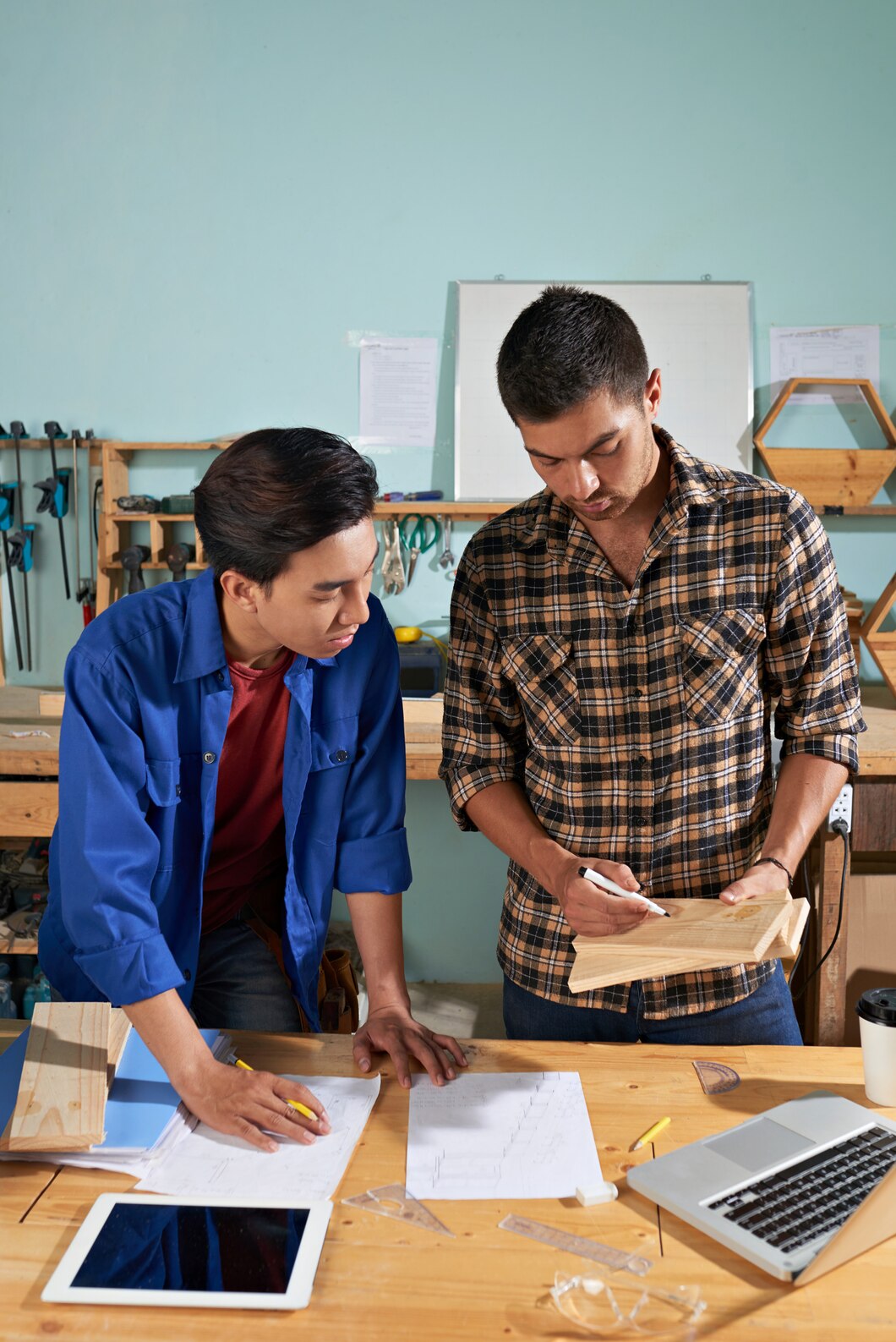 Senior professional mentoring a new employee in the workplace.
