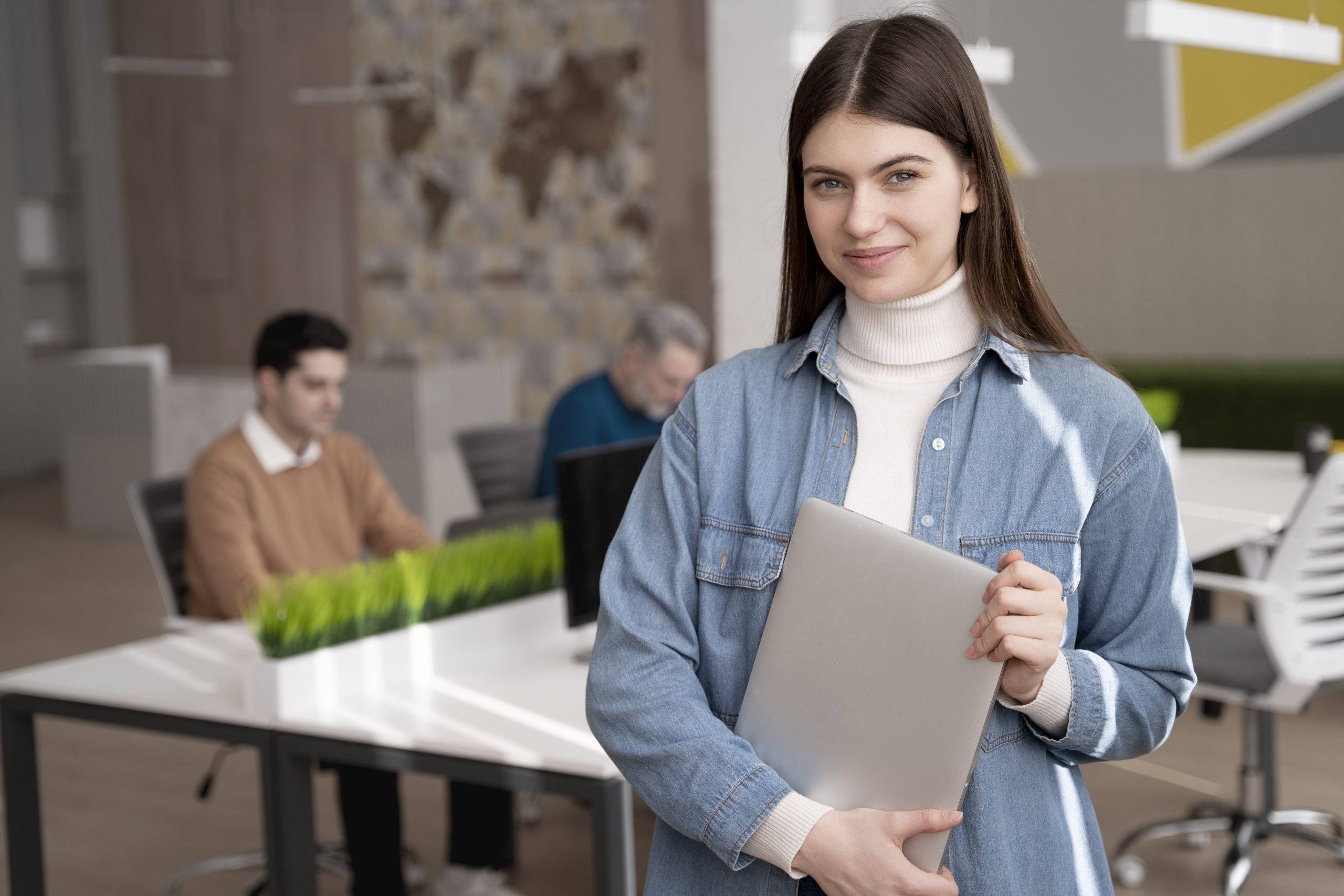 Young intern learning professional skills in an office.